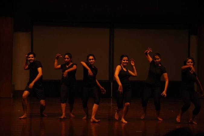 Artecology performers as primates coming to feast on figs